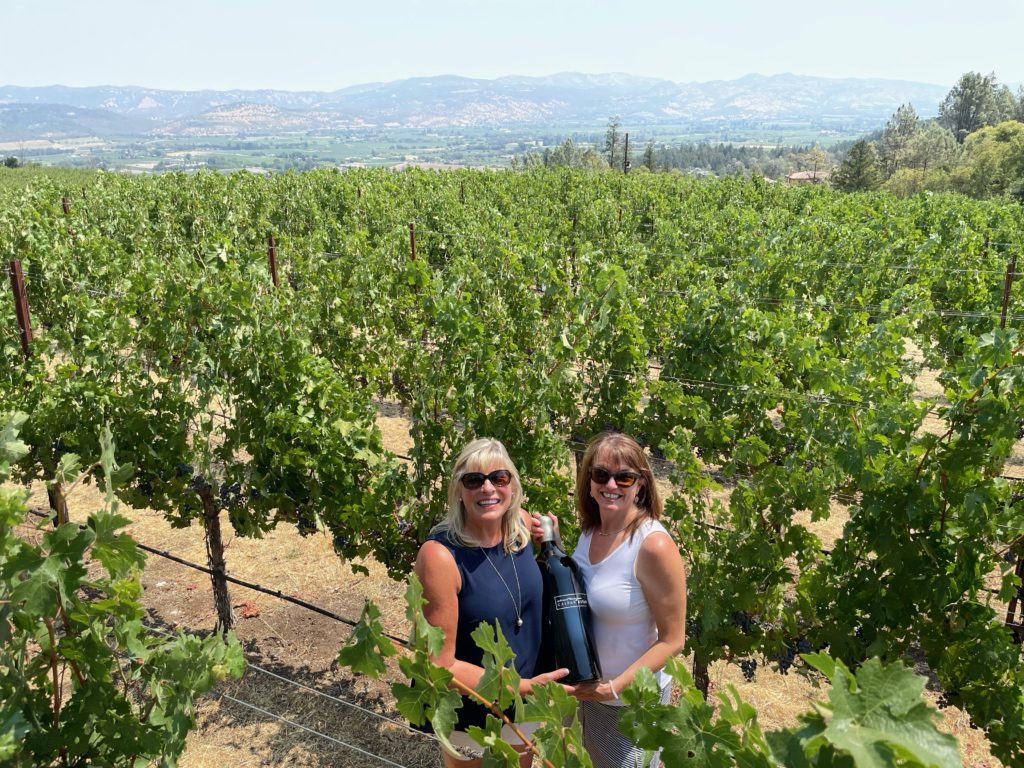 Two women in the vineyards at Caspar Estate