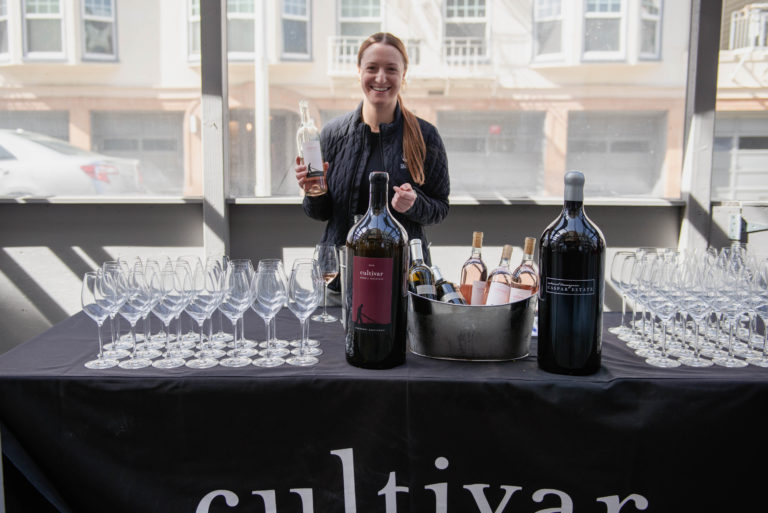 Woman pouring Cultivar wine at an event 